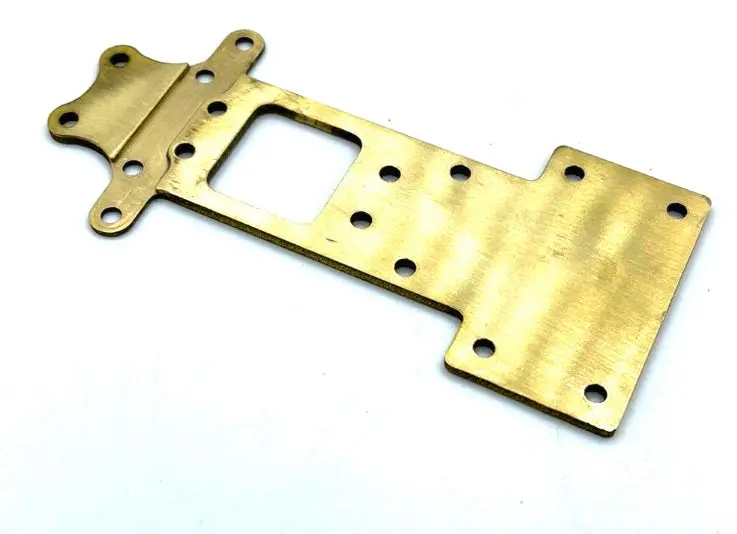 61046 Brass Transmission Riser Plate (Notched) W/ Breakout Wheelie Bar Tab 1