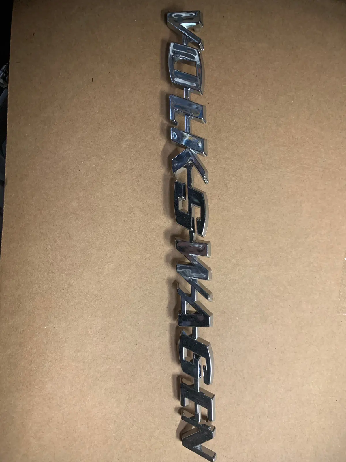"Volkswagen" Script Badge Plastic 1