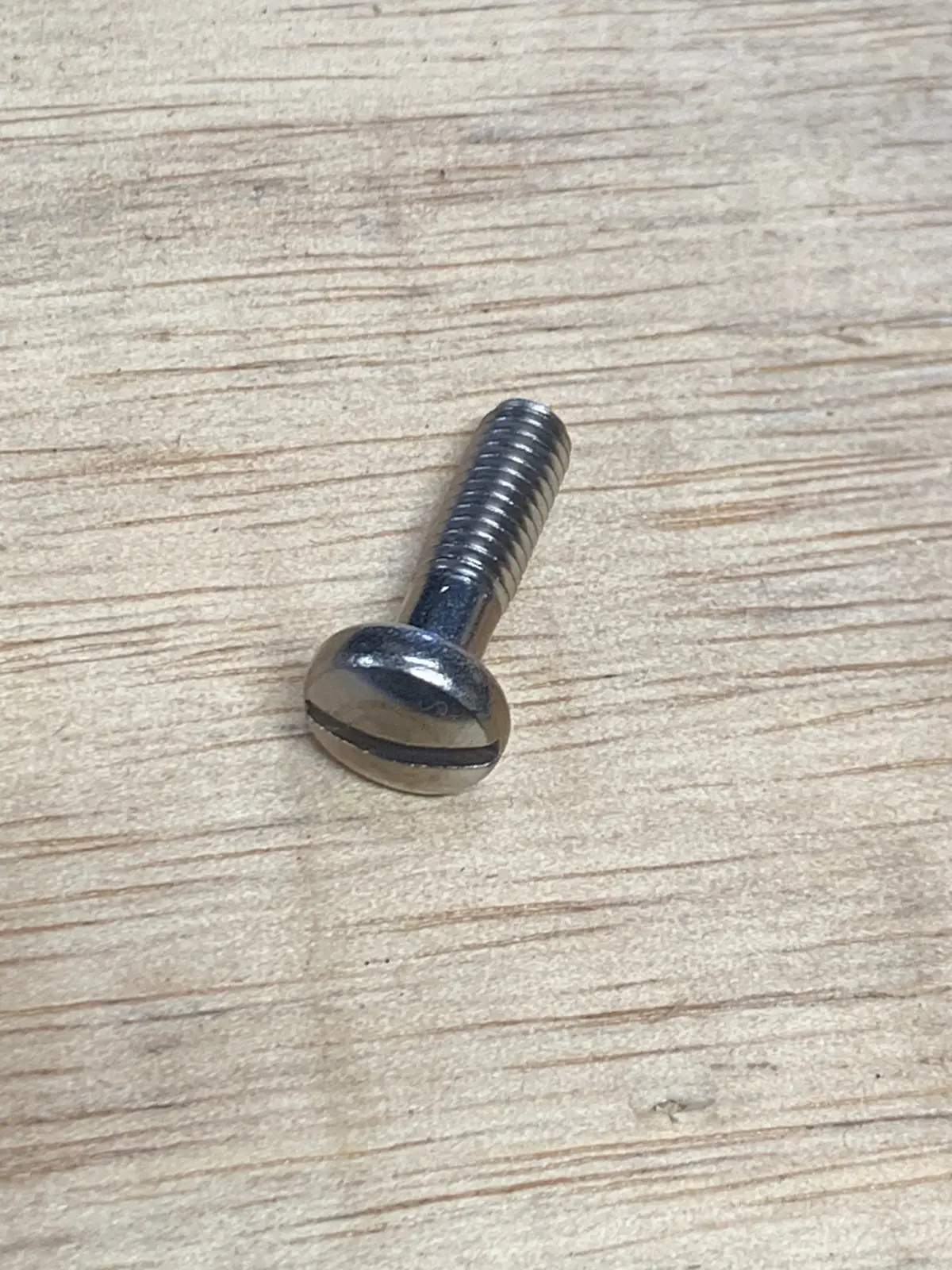 Headlight Rim Retaining Screw, Early 1